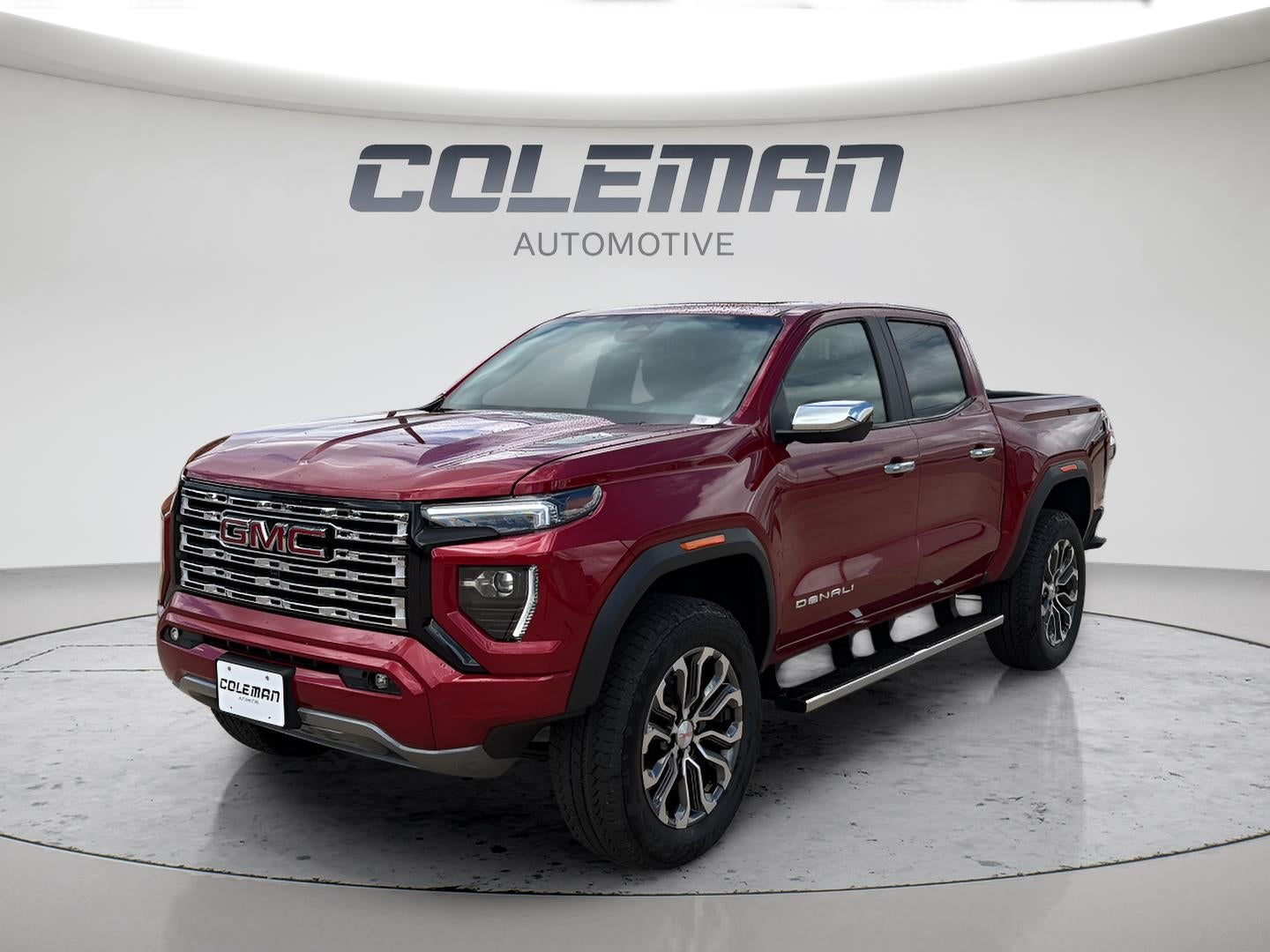 2026 GMC Canyon Denali in Volcanic Red Tintcoat — front three-quarter view